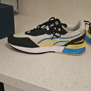 PUMA Black and White Sneakers with Blue and Yellow Accents